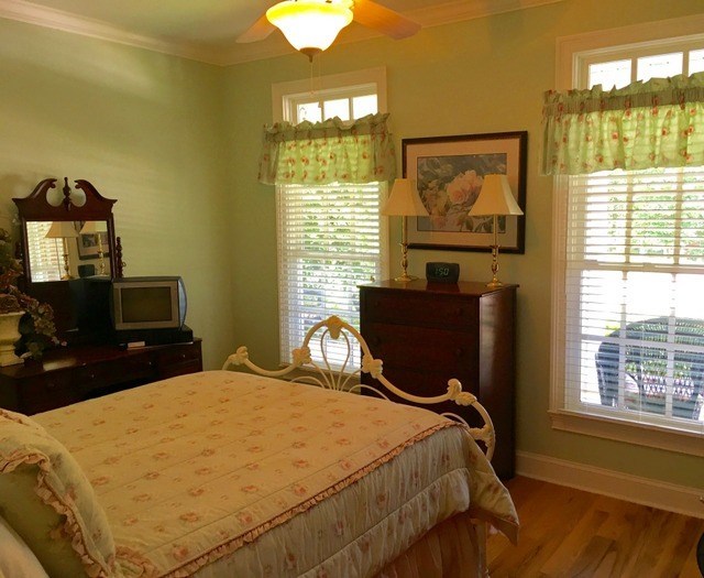 8630 East Hopewell Road Musella, GA 31066 - Photo 19 of 28 a bedroom with a bed and wooden floor