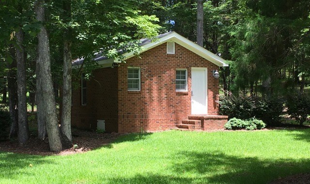 8630 East Hopewell Road Musella, GA 31066 - Photo 24 of 28 a front view of a house with garden