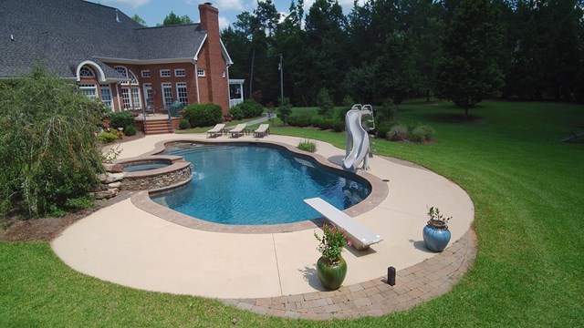 8630 East Hopewell Road Musella, GA 31066 - Photo 27 of 28 a view of a house with swimming pool and yard
