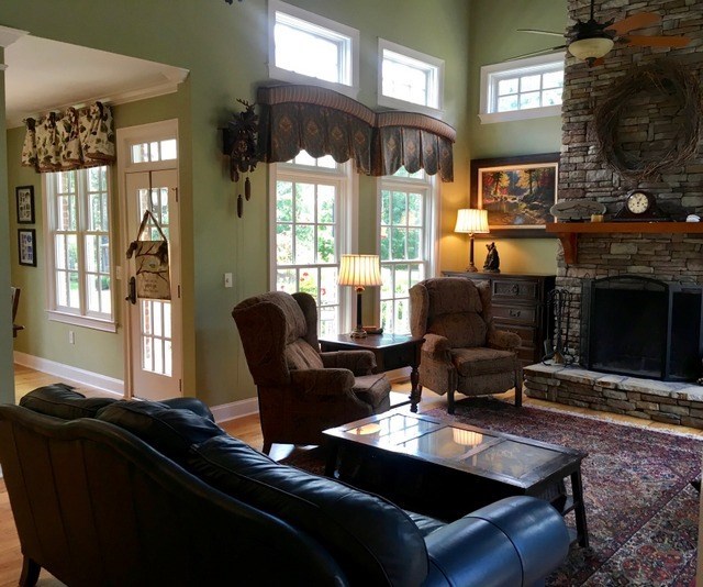 8630 East Hopewell Road Musella, GA 31066 - Photo 8 of 28 a living room with furniture fireplace and a flat screen tv