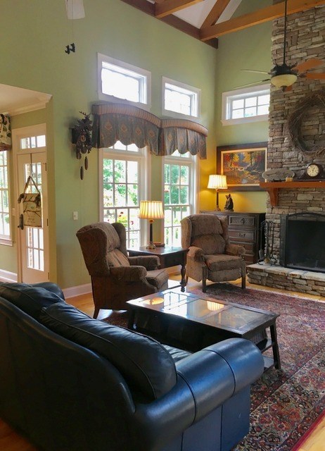 8630 East Hopewell Road Musella, GA 31066 - Photo 9 of 28 a living room with furniture and a fireplace
