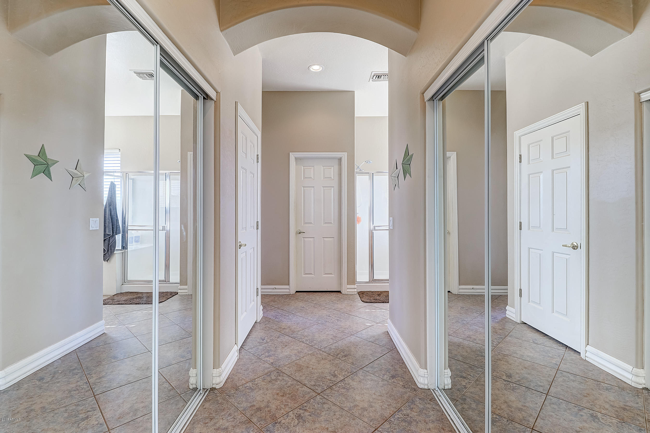 22850 West Sierra Ridge Way Wittmann, AZ 85361 - Photo 15 of 27 Double Closets Going Into Master Bathroo