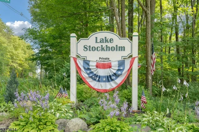 a sign on the side of the tree