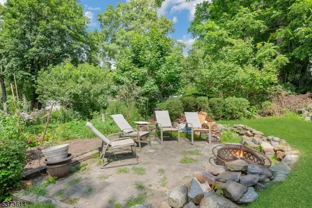a view of a chair and tables in the garden