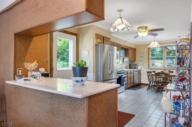 a view of a dining room with furniture window and outside view