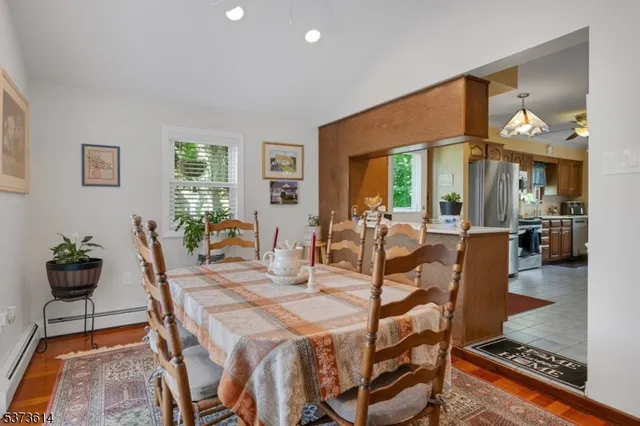 a dining room with furniture and window