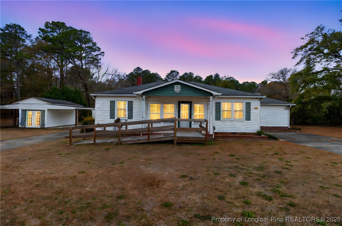 150 Old Vander Road Fayetteville, NC 28312 - Photo 1 of 38 a view of a house with backyard and sitting area