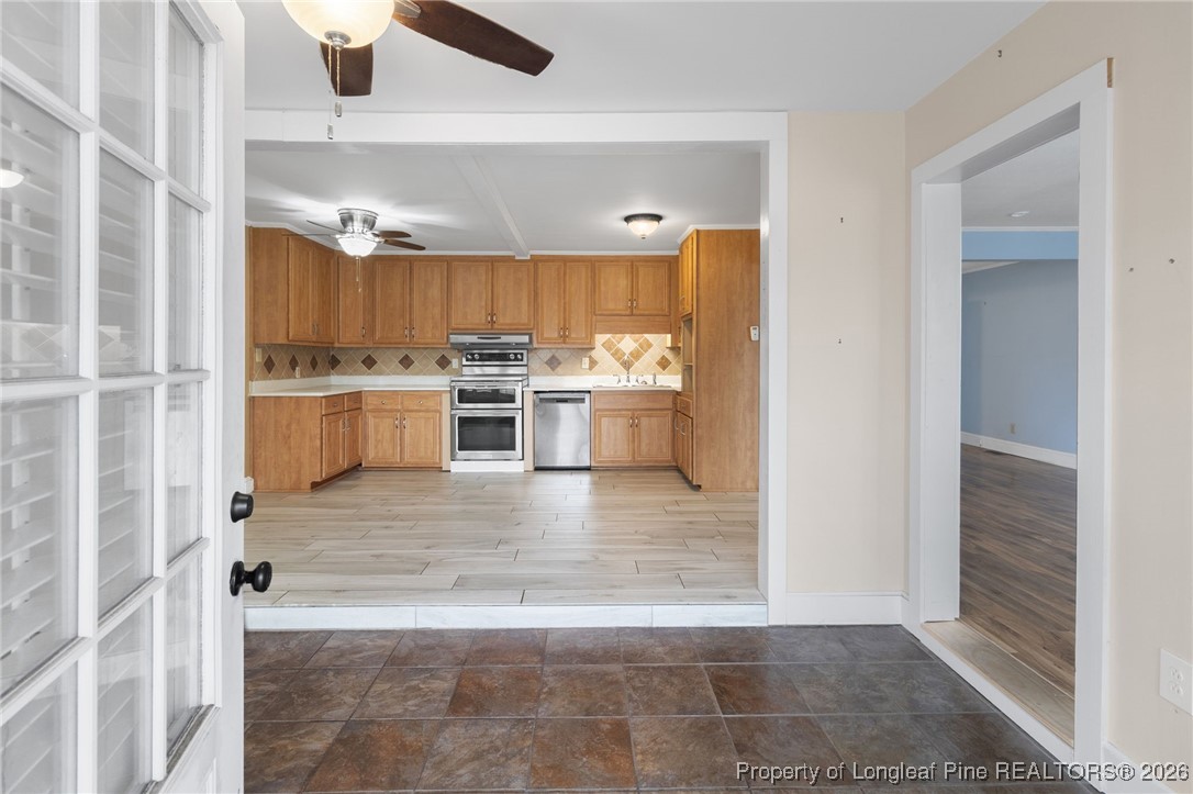 150 Old Vander Road Fayetteville, NC 28312 - Photo 11 of 38 a view of a kitchen with kitchen island wooden floors and stainless steel appliances