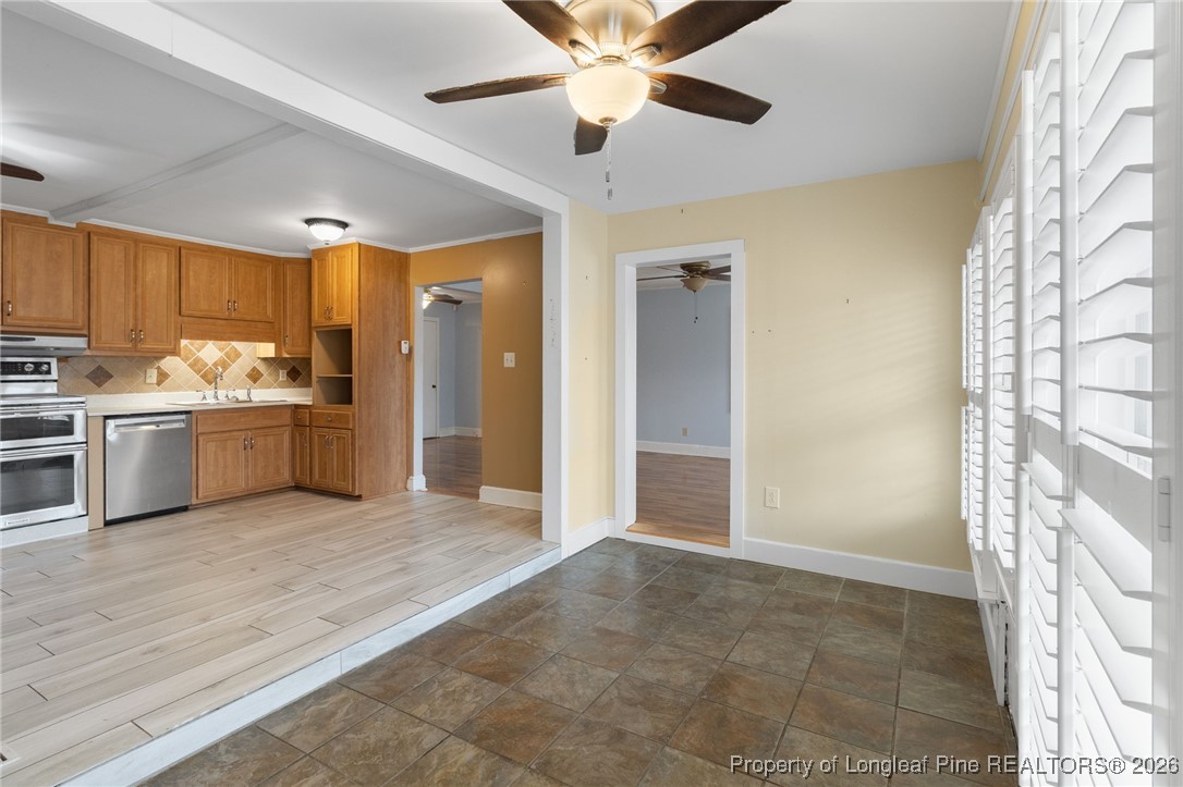150 Old Vander Road Fayetteville, NC 28312 - Photo 12 of 38 a view of a kitchen with a stove cabinets and a kitchen