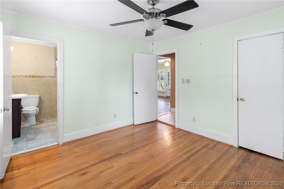 150 Old Vander Road Fayetteville, NC 28312 - Photo 14 of 38 an empty room with wooden floor and windows