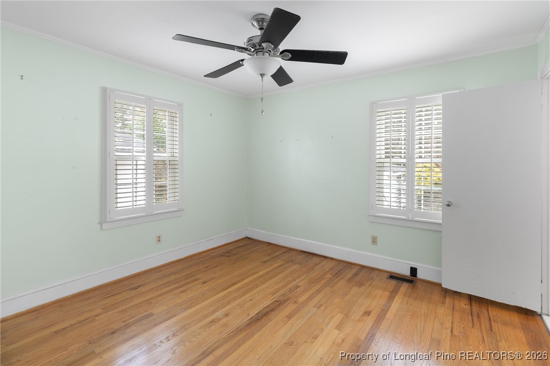 150 Old Vander Road Fayetteville, NC 28312 - Photo 18 of 38 a view of an empty room with wooden floor and a window