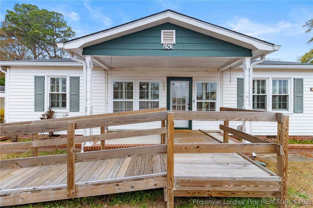 150 Old Vander Road Fayetteville, NC 28312 - Photo 2 of 38 a view of a house with backyard and sitting area