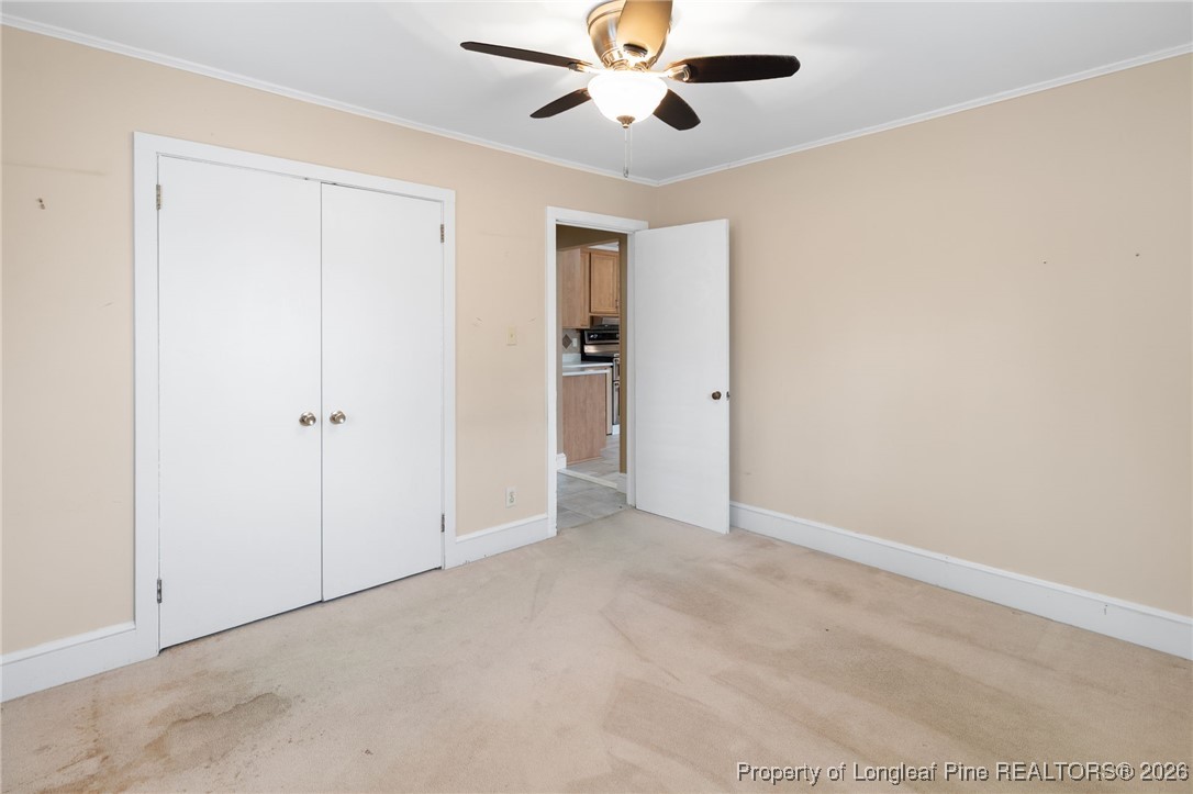 150 Old Vander Road Fayetteville, NC 28312 - Photo 22 of 38 an empty room with closet and a ceiling fan