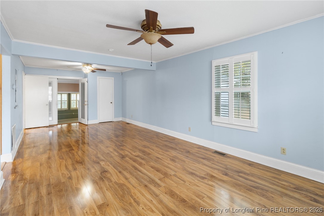 150 Old Vander Road Fayetteville, NC 28312 - Photo 27 of 38 a view of empty room with wooden floor and fan