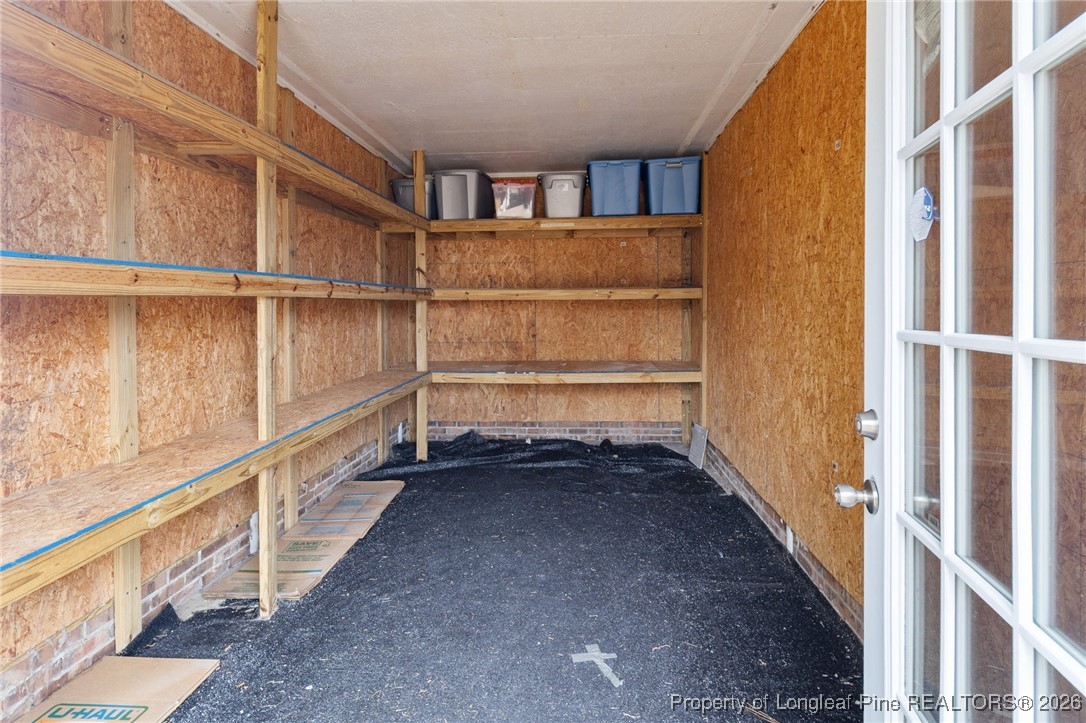 150 Old Vander Road Fayetteville, NC 28312 - Photo 35 of 38 a view of walk in closet with empty racks