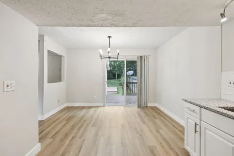 a view of a backyard with swings