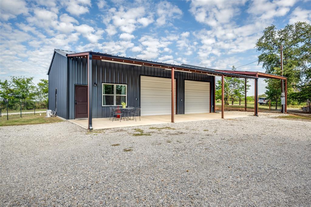 227 Lanier Road Forestburg, TX 76239 - Photo 2 of 33 Shop with living space and very large covered porch area.