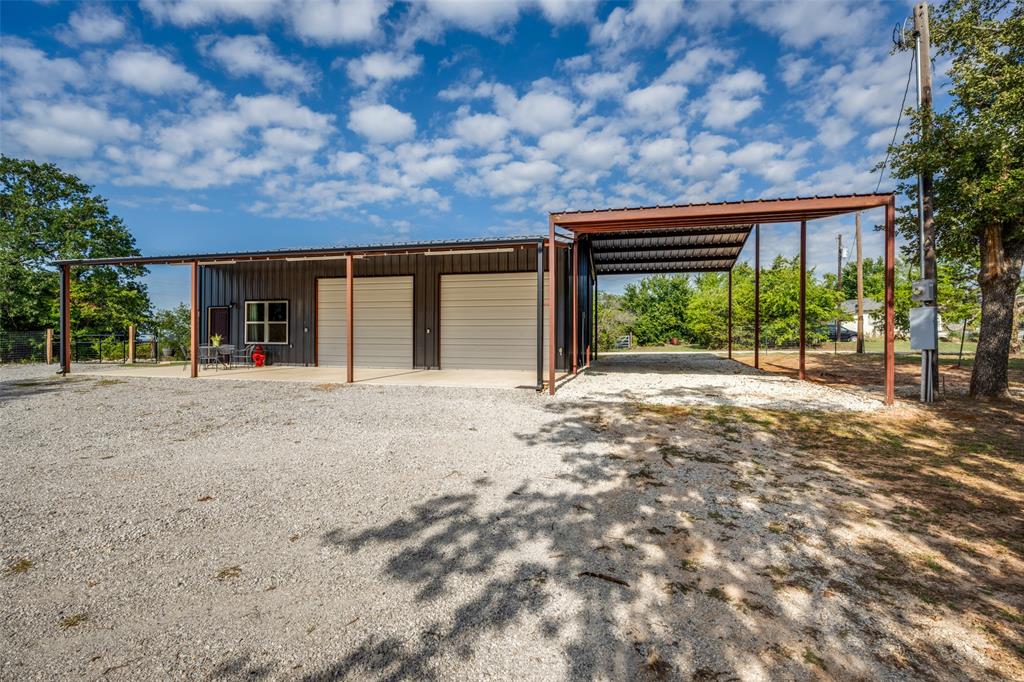 227 Lanier Road Forestburg, TX 76239 - Photo 3 of 33 Lots of covered space for all the toys.