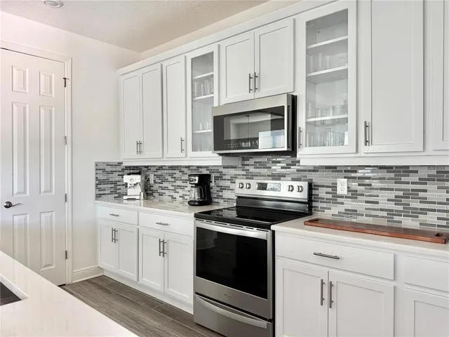 a bedroom with a bed and a potted plant