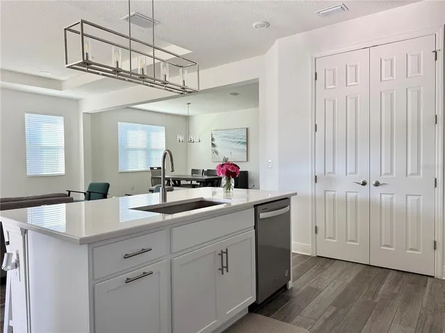 a bedroom with a bed and a window dresser