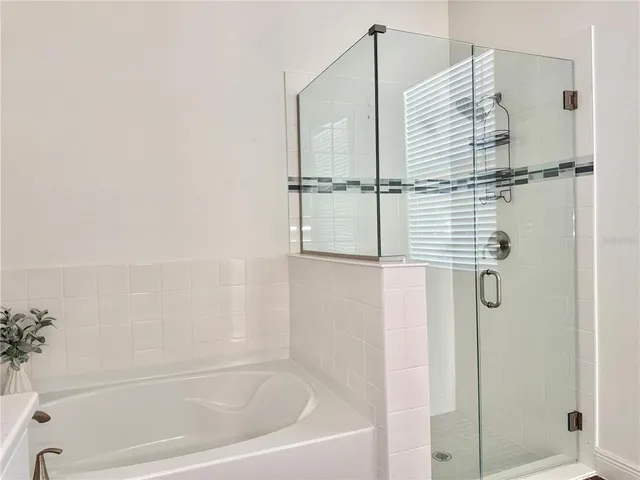 a bedroom with a bed and a chair