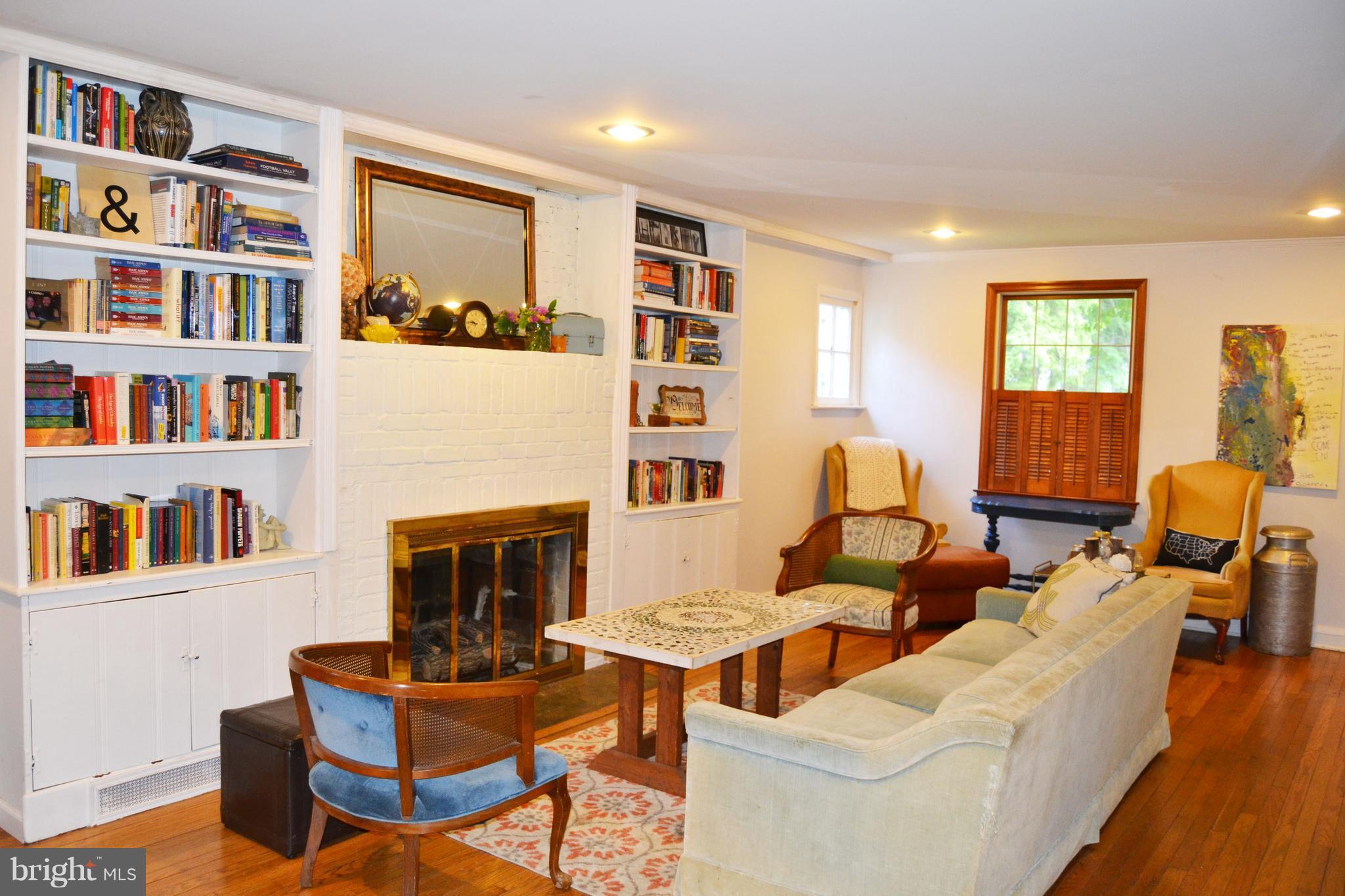 3647 Campfield Road Baltimore, MD 21207 - Photo 5 of 30 Build-in bookcases and hardwood floors