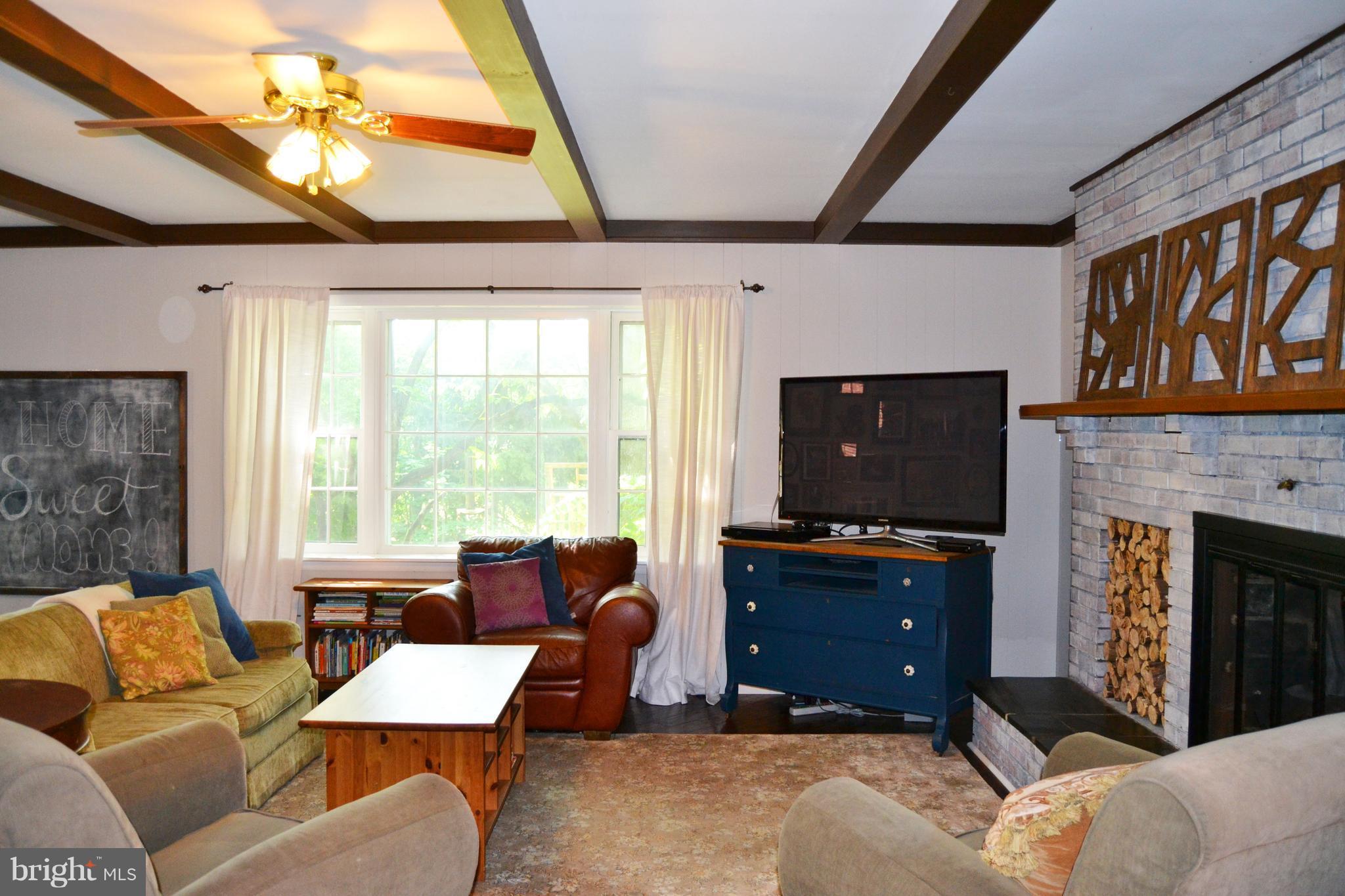 3647 Campfield Road Baltimore, MD 21207 - Photo 7 of 30 Big windows, hardwood floors and wood beams