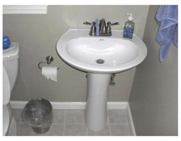 333 Service Road, Unit 2 Sandwich, MA 02537 - Photo 7 of 8 a bathroom with a sink and a mirror