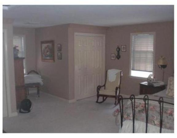 333 Service Road, Unit 2 Sandwich, MA 02537 - Photo 8 of 8 a living room with furniture a window and a chair