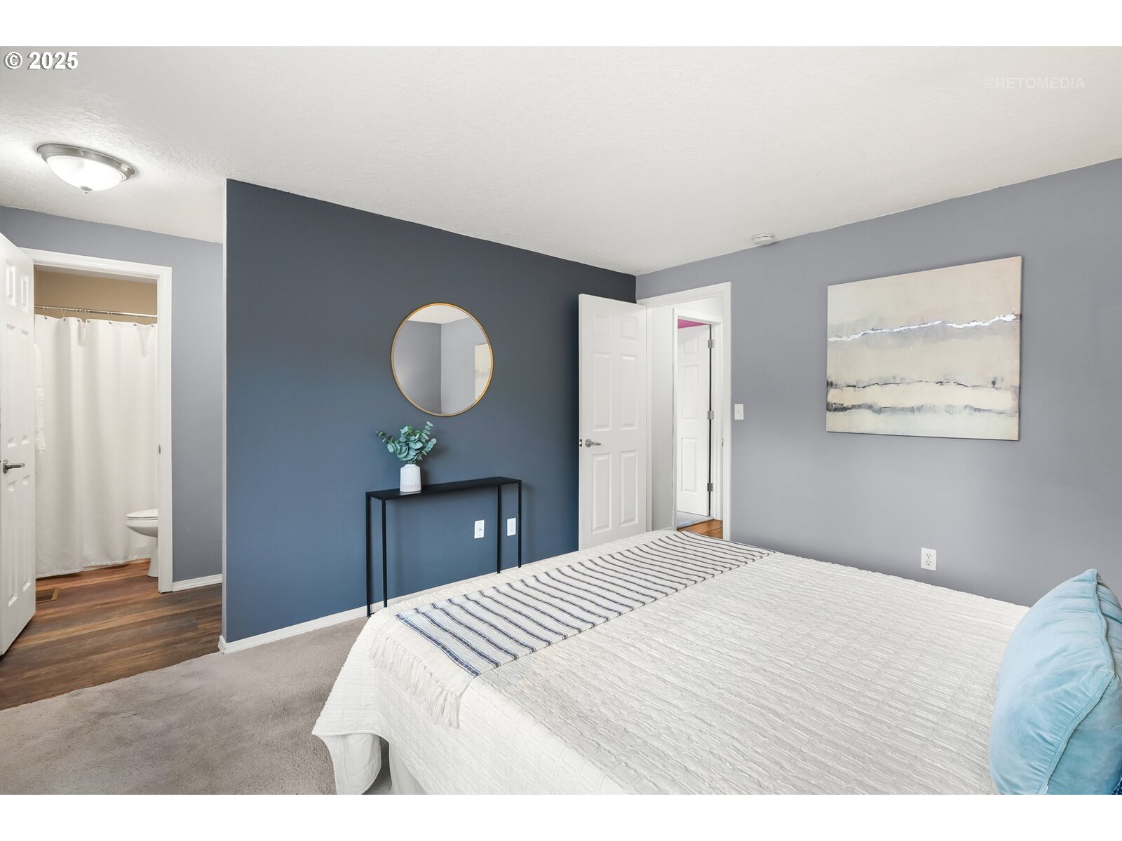 20490 Southwest Frances Street Beaverton, OR 97003 - Photo 18 of 32 a bedroom with a bed and a chandelier