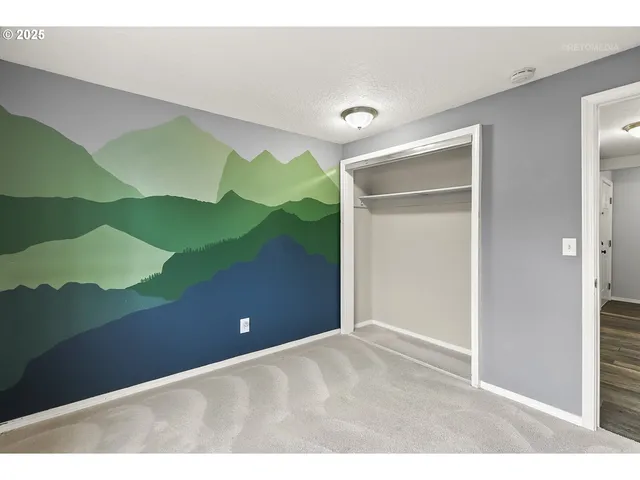 a view of a livingroom with an empty space and window