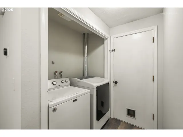 a backyard of a house with large trees