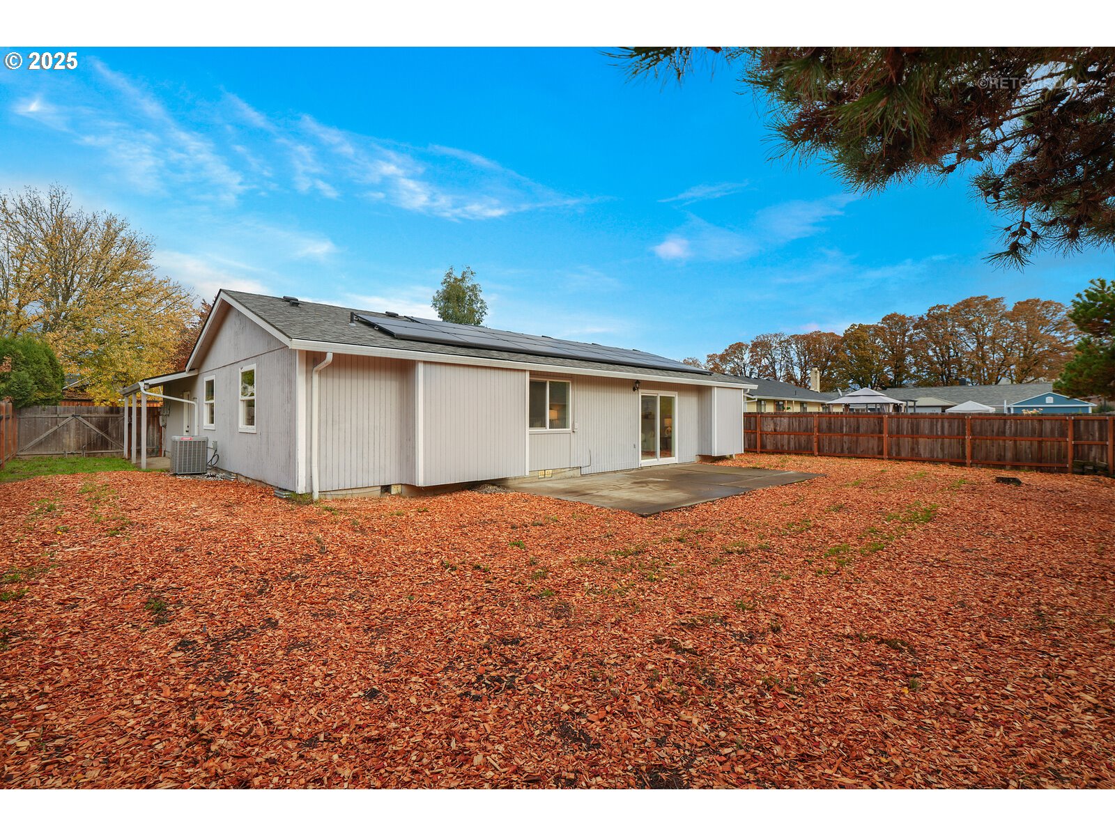 20490 Southwest Frances Street Beaverton, OR 97003 - Photo 29 of 32 a backyard of a house with large trees