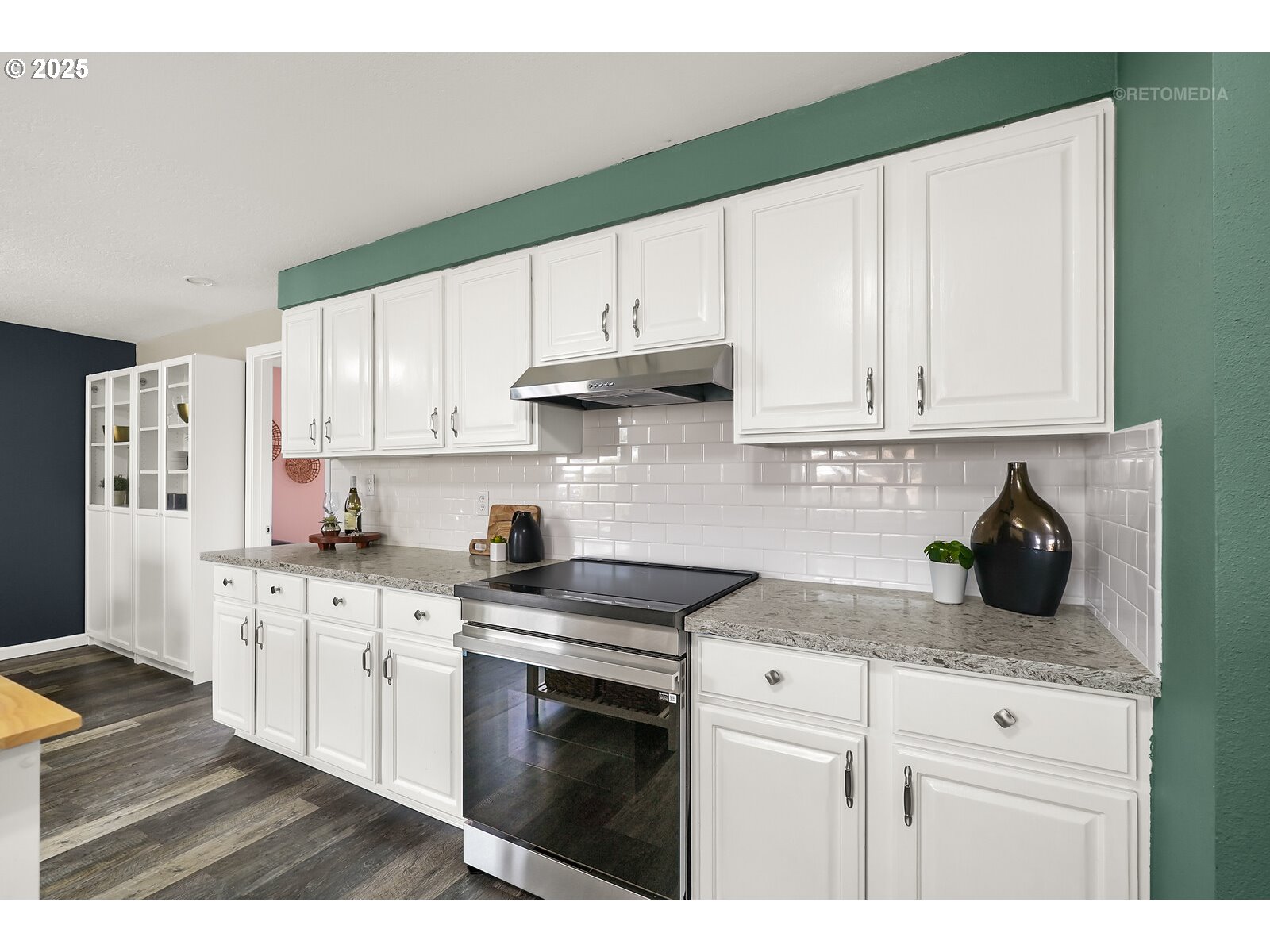 20490 Southwest Frances Street Beaverton, OR 97003 - Photo 9 of 32 a kitchen with stainless steel appliances granite countertop a stove a sink and white cabinets