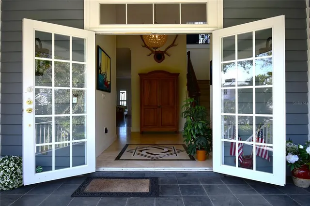a view of an entryway with wooden floor