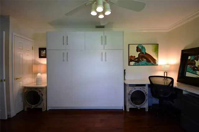 a work place with furniture and a window