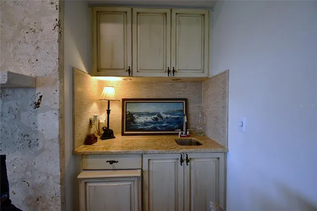 a bedroom with a bed a large window and flat screen tv