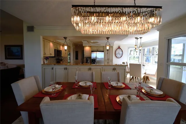 a kitchen with stainless steel appliances a refrigerator sink microwave and stove