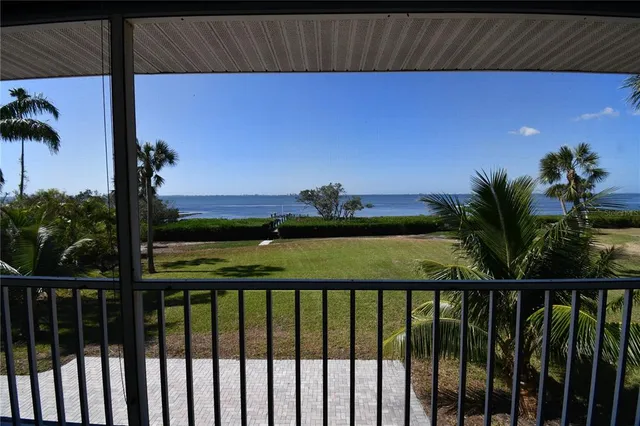 a dining room with furniture window and wooden floor