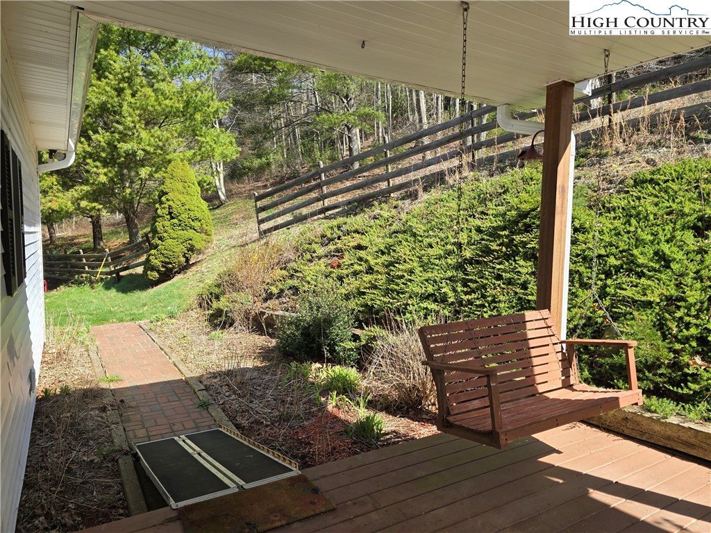 3160 Roundabout Road Creston, NC 28615 - Photo 13 of 50 a view of a bench in the balcony
