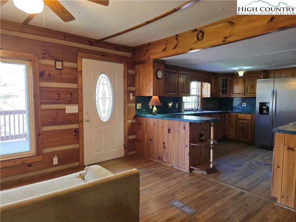 3160 Roundabout Road Creston, NC 28615 - Photo 14 of 50 a kitchen with granite countertop a sink a stove and cabinets