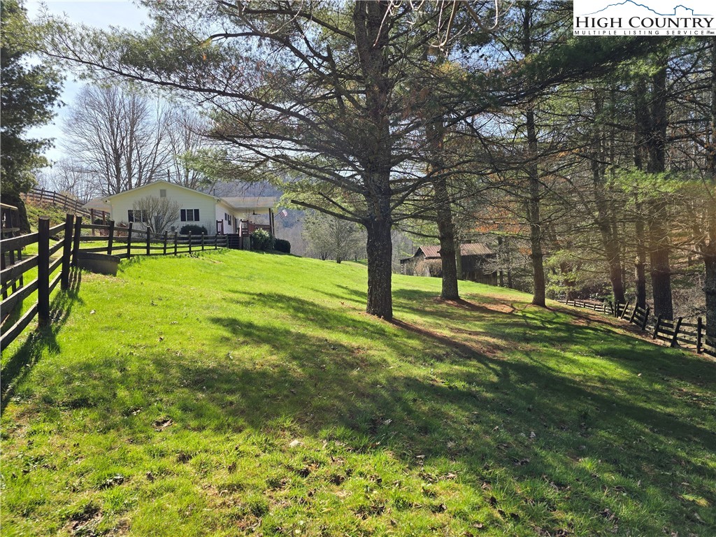 3160 Roundabout Road Creston, NC 28615 - Photo 2 of 50 a view of a park with large trees