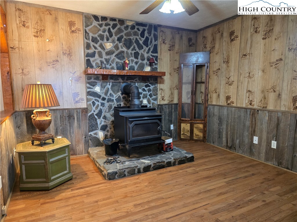 3160 Roundabout Road Creston, NC 28615 - Photo 21 of 50 a living room with furniture and a fireplace
