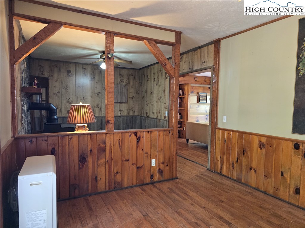 3160 Roundabout Road Creston, NC 28615 - Photo 22 of 50 a view of an empty room with wooden floor and a window