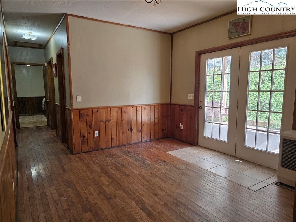 3160 Roundabout Road Creston, NC 28615 - Photo 23 of 50 a view of an empty room with wooden floor and a window