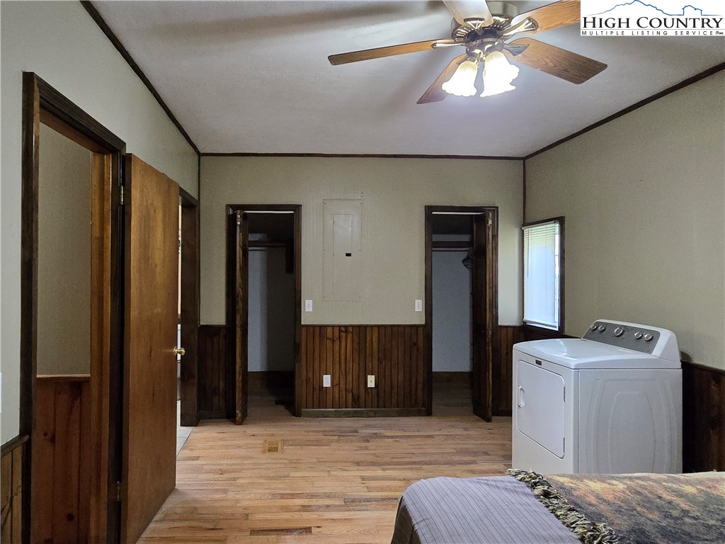 3160 Roundabout Road Creston, NC 28615 - Photo 25 of 50 a bedroom with a bed and a chandelier