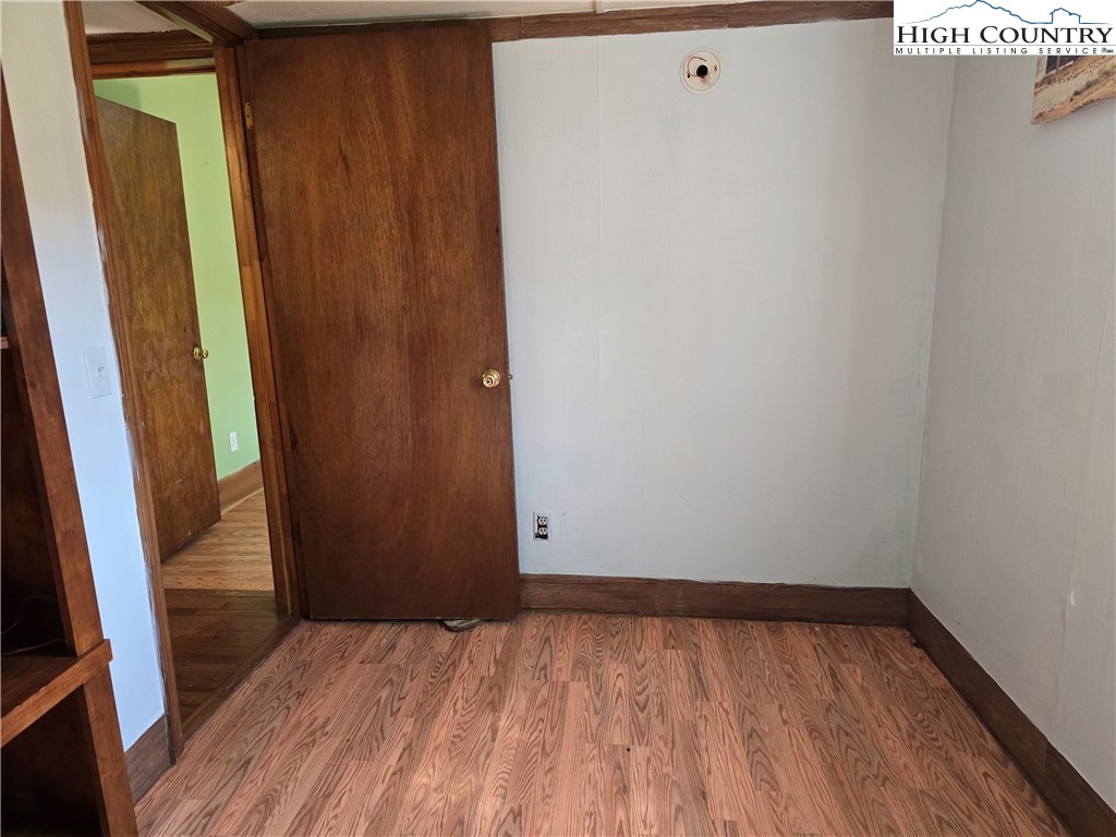 3160 Roundabout Road Creston, NC 28615 - Photo 33 of 50 a view of empty room with wooden floor