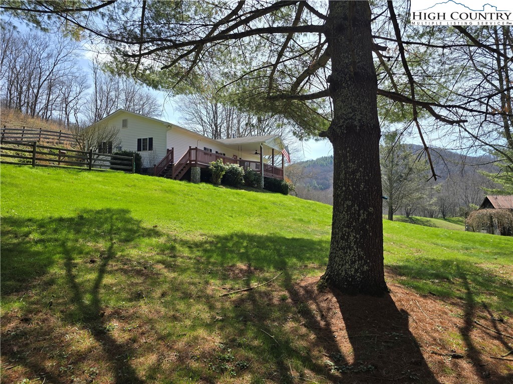 3160 Roundabout Road Creston, NC 28615 - Photo 9 of 50 a front view of a house with garden