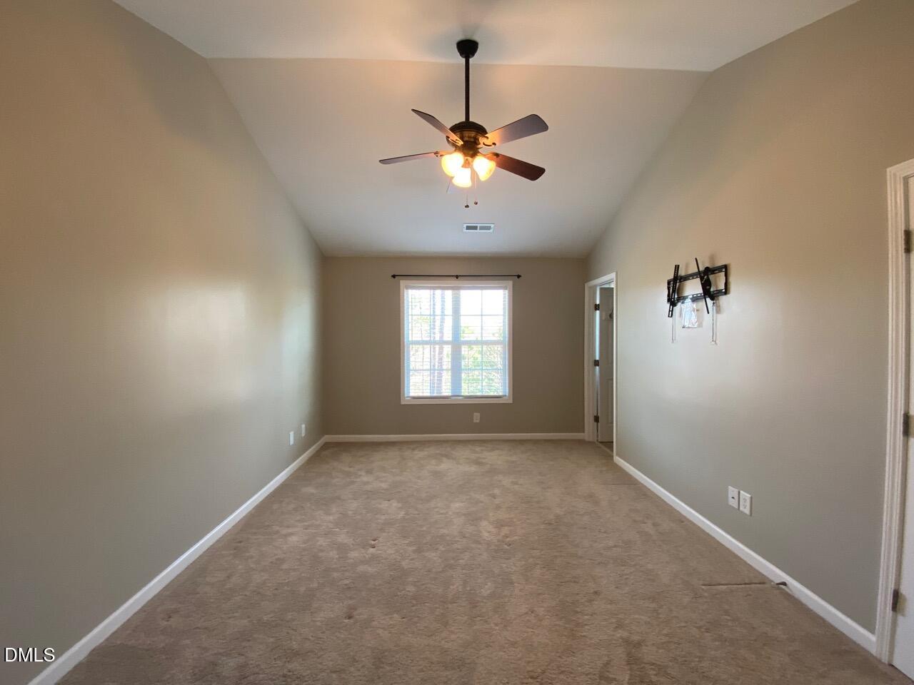 2513 Bay Harbor Drive Raleigh, NC 27604 - Photo 11 of 19 a view of a room with a ceiling fan and window