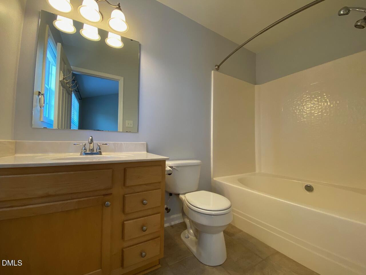 2513 Bay Harbor Drive Raleigh, NC 27604 - Photo 14 of 19 a bathroom with a sink a toilet and a bathtub